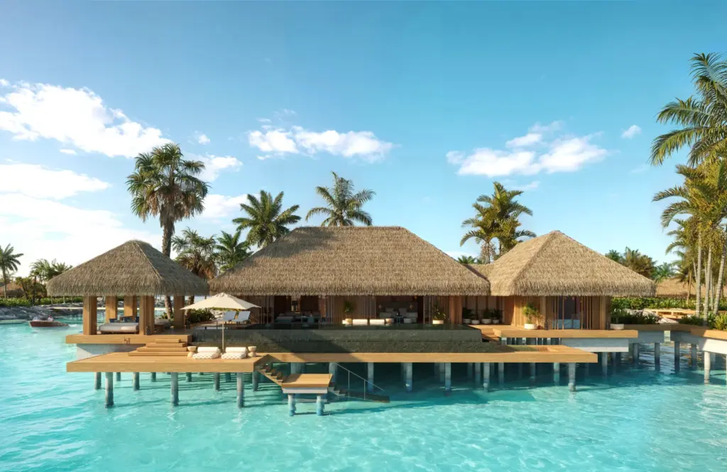 Собственный бассейн, открытая терраса и спуск в лагуну у надводной виллы Maxx Royal Maldives.