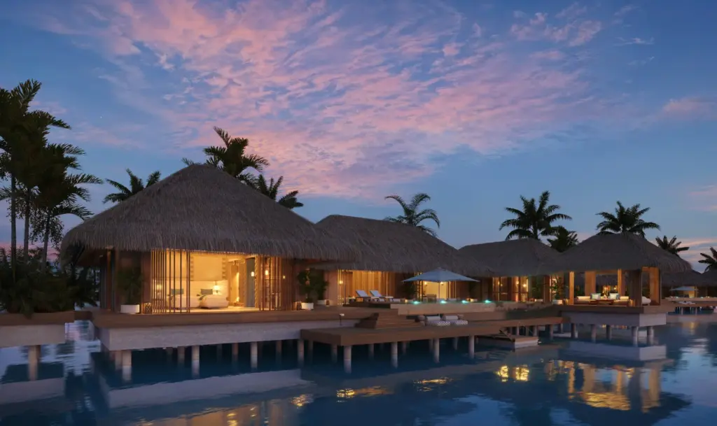 Надводная вилла Maxx Royal Maldives в вечернем освещении.